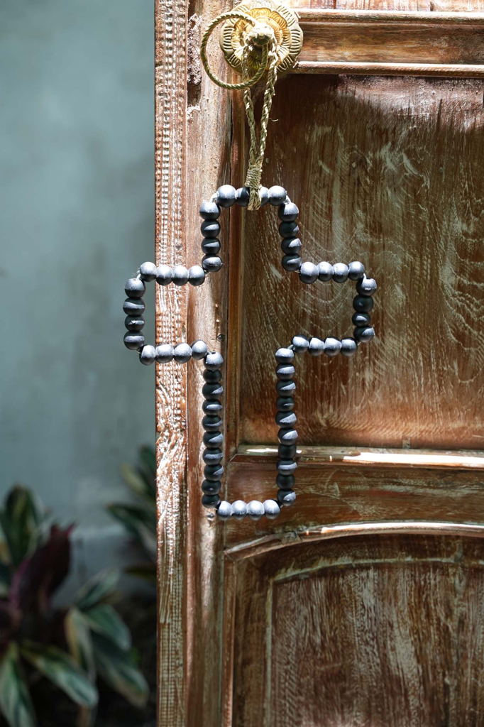 La décoration murale en forme de croix en bois - Noir